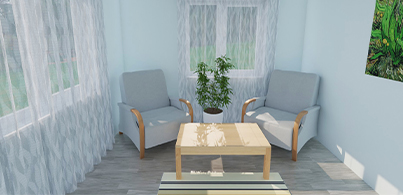 imple cozy room design with light blue walls, wood furniture, patterned rug, and potted plant